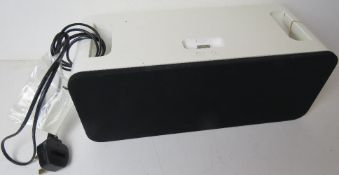 An Apple IPod speaker with cable.