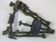 A DISA tripod with carry straps.
