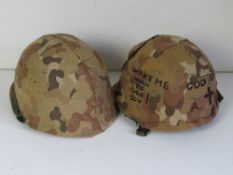 A 1970 US M1 helmet with chin strap and