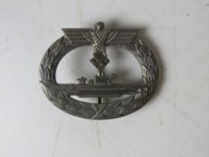 A WWII German 'silver' Submarine badge marked FO to back.