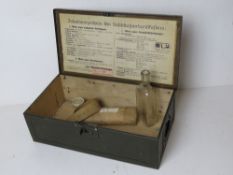 A WWII German Luftschutz First Aid box with accessories.