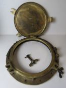 A large and impressive solid brass ships porthole with cover, glass deficient, approx 53cm dia, 32.