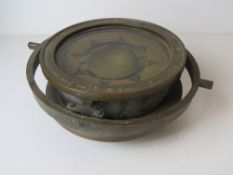 A Marine compass in gimble marked 'Lionel Corporation NY 1944', bezel approx 24.5cm dia.