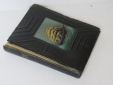 A WWII Japanese Naval Officers photo album. Original personal family shots in ship themed album.