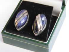 A pair of silver and blue goldstone stud earrings with butterfly backs in presentation box.
