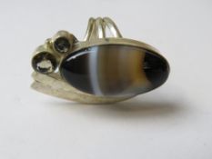 A large hardstone cocktail ring stamped 925, size O-P in presentation box.