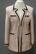 A 70% wool coat in peach with black patt