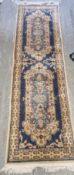 A woollen runner in cream and blue ground in need of cleaning, measuring approx. 240 x 68cm.