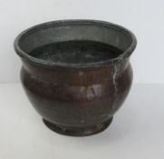 A copper planter standing approx 22cm high, appros 28cm dia.