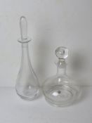 A Dartington crystal decanter bearing label upon, together with another similar.