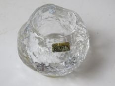 A Kosta Boda tealight holder.