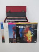A quantity of assorted laser discs within a single leatherette travel case. List attached verso.