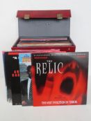 A quantity of assorted laser discs within a single leatherette travel case. List attached verso.