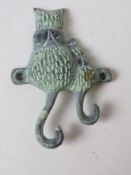 A metal cat and kitten key hook.