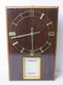 A mid century day date wall clock marked Puja to the movement.