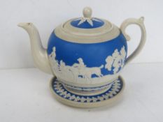 A Copeland Spode teapot and stand in the blue and white Jasperware style,