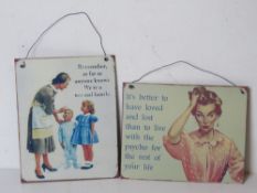 Two contemporary metal decorative signs.