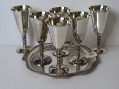A set of six silver plated goblets with associated silver plated tray.