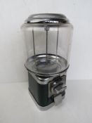 A vintage gumball machine by Beaver having perspex window, key deficient.