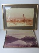 Two photographic prints, one of a lake with mountains beyond, the other of a giraffe,