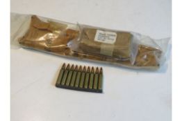 An M16 sling in packaging dated 1965, the bipod in packaging dated 1975 and ten 5.