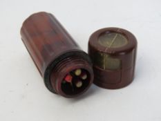 A WWII British SOE escape and evasion survival waterproof tube.