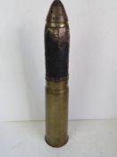 An inert WWI 13 Pounder High explosive Shrapnel QF (Quick Fire) Cannon shell with fuse timer,