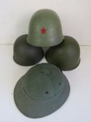 For assorted helmets, being a Russian helmet with chin strap, a Russian helmet with US liner,
