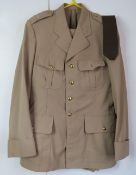 A matching US tunic and trousers, with tie, both labelled J Veyrier Paris 1970.