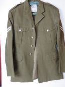 A British Army No 2 dress tunic, size 32, having patches and buttons upon.