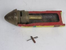 A WWI three inch cutaway HE shell with timer dated 1944.