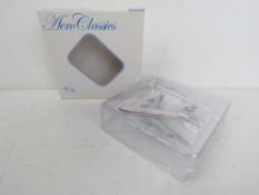 An Aero Classics scale model in Qantas l