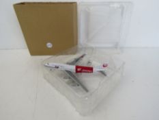 A die cast scale model Boeing 747 in Jap
