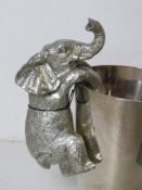 A silver painted elephant wine cooler decoration, as new with tag.