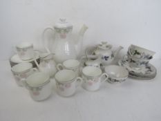 Two Royal Doulton part tea sets being Twilight Rose and Burgundy patterns. Burgundy teapot a/f.