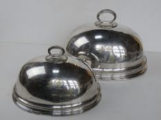 A pair of graduated silver plated tureen covers having double crest upon with makers mark HE Co Ltd