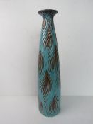 A large contemporary floor standing vase in turquoise with rippled leaf pattern upon standing 57.