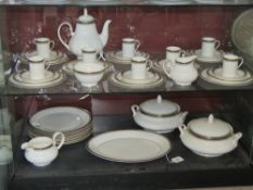 A Royal Doulton coffee and dinner service for eight, in Pavanne H5095, includes two tureens,