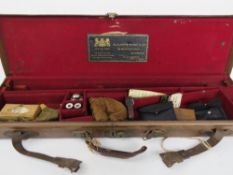 A leather shotgun case bearing label for Alexander Henry & Co.