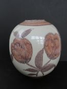 A large West German bulbous vase in stone ground with pink and brown floral design upon approx.