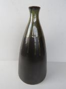 A large contemporary matte black vase with green trickle glaze stem standing 45cm high.