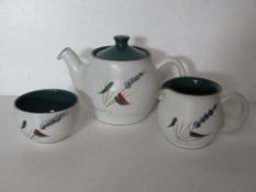 A Denby teapot with matching sugar bowl and jug.