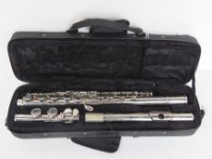 A Windsor flute in fitted case.