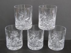 A set of five cut glass whisky tumbler.