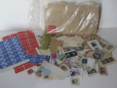 A quantity of 20th century stamps including some part sheets, unused loose stamps, etc.