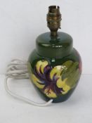 A Moorcroft table lamp in the form of a ginger jar,