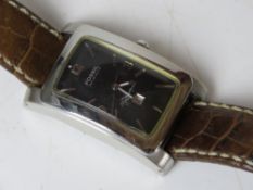 A men's Fossil Aut-O-Matic Signature wrist watch having skeleton back,