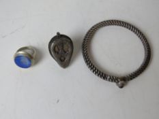 Two handmade white metal rings, one set with lapis lazuli together with a heavy handmade bracelet.