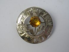 A hallmarked Scottish silver brooch having orange thistle design, hallmarked for Edinburgh, 3.
