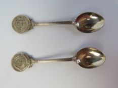 A pair of hallmarked silver spoons with CHC monogrammed terminals, 47.2g / 1.